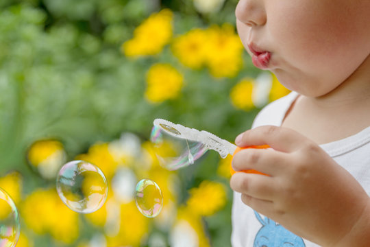 Boy Blowing Bubbles