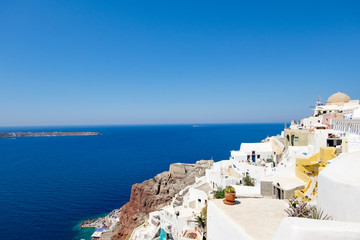 view with traditional white buildings over the village of Oia