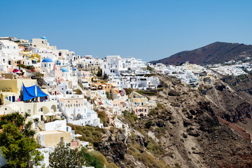 view with traditional white buildings over the village of Oia