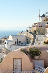 Fototapeta premium view with traditional white buildings over the village of Oia