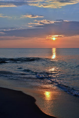 Fototapeta premium Serene Summer Seas at Sunrise at the Shore
