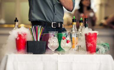 Barman show. Bartender is preparing alcoholic fuming cocktails.