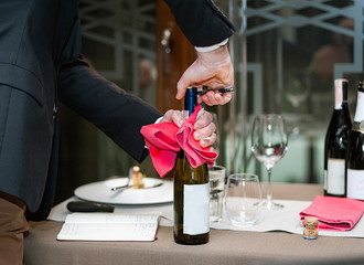 Delicious grilled steak on plate with glass of wine