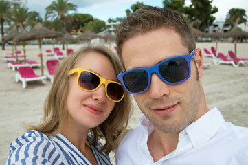 Selfie. Couple taking picture on the beach.
