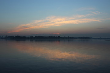 Fototapeta na wymiar dawn.river.sky.Volga river.clouds.water