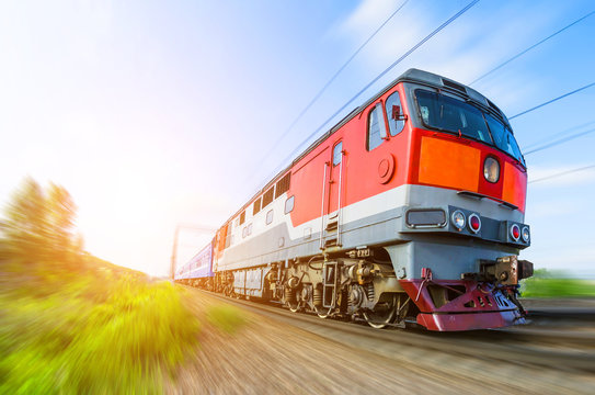 Fototapeta Passenger diesel train traveling speed railway wagons journey light
