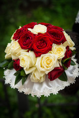 wedding bouquet from roses on a green background