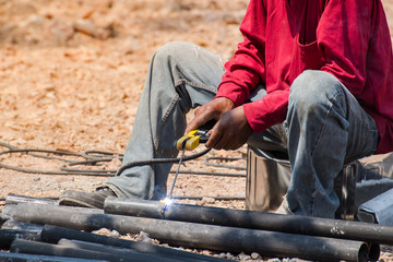 A man skilled working factory welder,cutting,grinding,drill