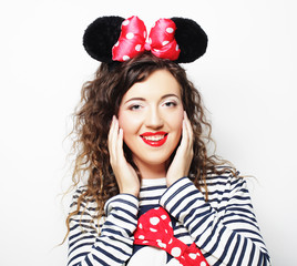  young woman with mouse ears over white background