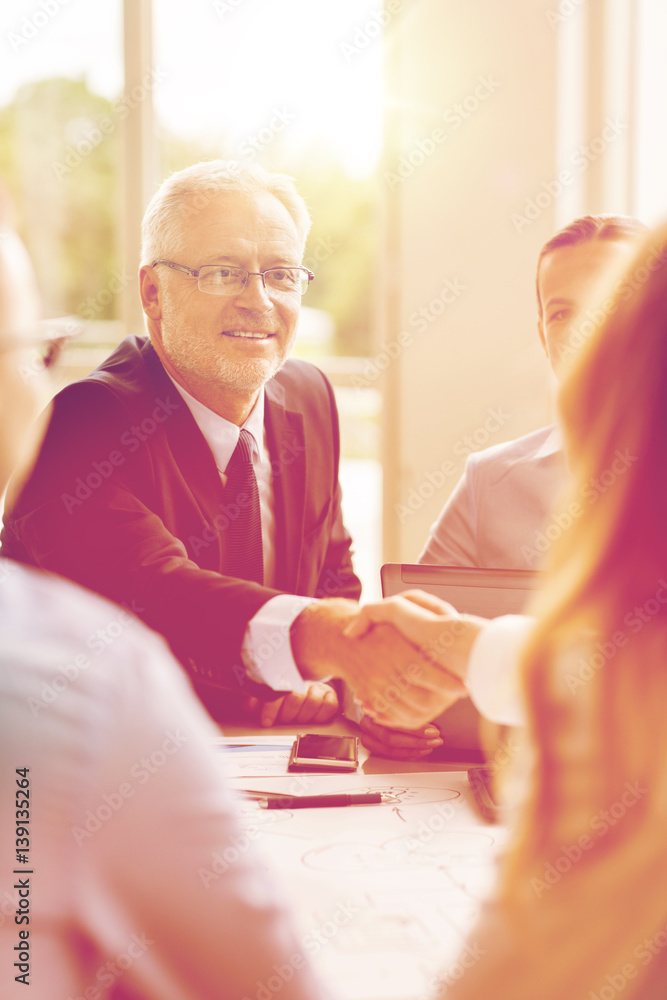 Poster senior businessman making handshake at office