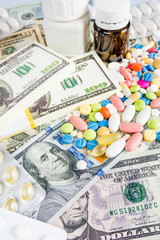 medication concept.  Medicine pills with money dollar. Cost of the healthy life