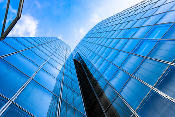 Fototapeta na wymiar Blue skyscraper facade. office buildings. modern glass silhouettes of skyscrapers