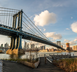 Naklejka na ściany i meble Manhattan Bridge and Manhattan Skyline seen from Dumbo in Brooklyn - New York, USA