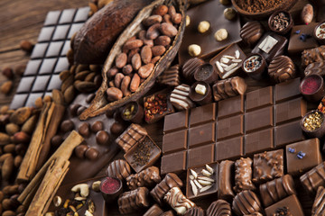 Dark and milk chocolate bar on a wooden table