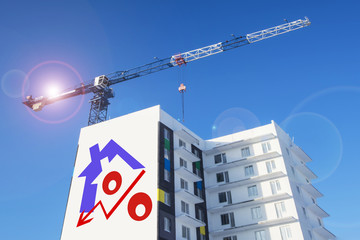 	Billboard on the background of building a house . The concept of reducing property prices