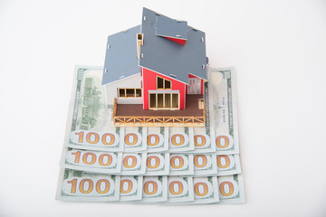 toy house on money bills