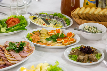 Appetizer caviar and fish. Sandwich with sea salmon and red caviar