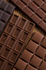 Bars Chocolate , candy sweet, dessert food on wooden background