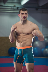 Fitness model posing in fighting stance