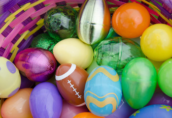 Fototapeta na wymiar Easter egg basket filled with decorative colorful eggs.