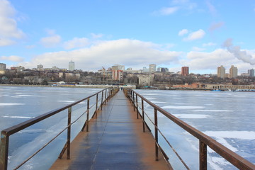 Fototapeta na wymiar the metal bridge over the river