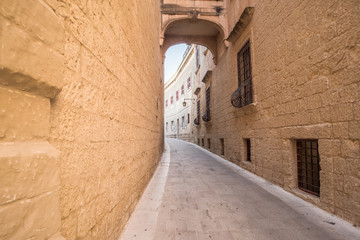 Fototapeta na wymiar Old street in Rabat, Malta, atmospheric, winding alley.
