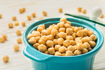 Chickpeas in turquoise ceramic pot