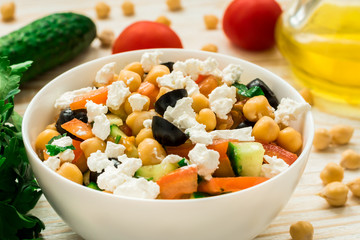 Mediterranean chickpea salad with cherry tomatoes, feta and olives