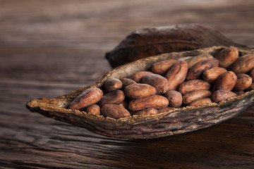 Cocoa pod on wooden background