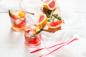 Grapefruit and rosemary gin cocktail, refreshing drink with ice