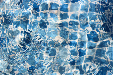 Water swirls in the pool. Texture. Abstract background concept