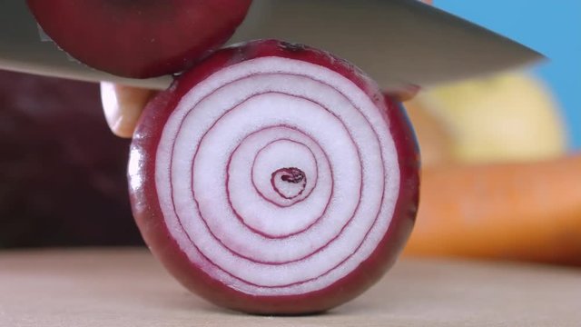 Cut red onion rings with knife