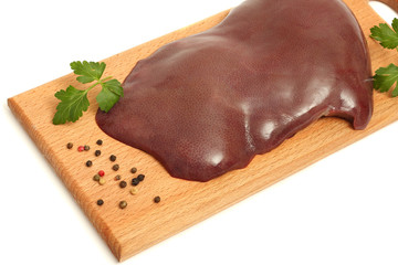Raw pig liver isolated on white background