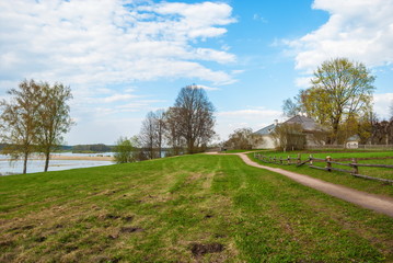 Spring rural landscape with road and river
