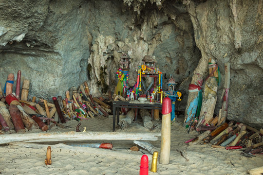 Wooden phalluses in Princess cave on Pranang beach in Krabi province, Thailand.