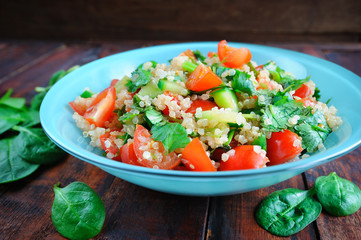 Tabbouleh salad on wooden table