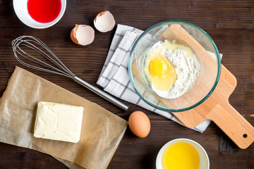 cooking pancake on wooden background top view ingredients for making