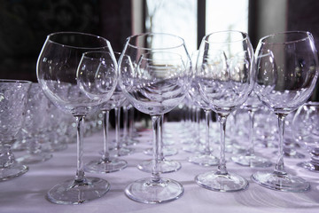 Empty clean drinking wine glasses. Row of empty wine glasses on bar counter