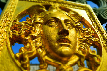 A golden face: detail of the original metal fence of the Royal Palace of Turin, Italy. Tilt-shift effect applied.
