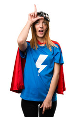 Pretty superhero girl making loser sign © luismolinero