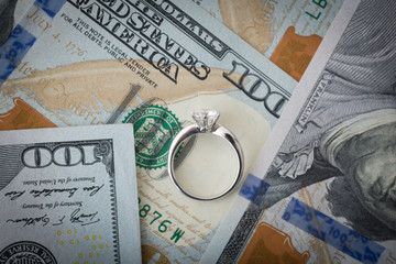 money and diamond ring