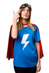 Pretty superhero girl making suicide gesture