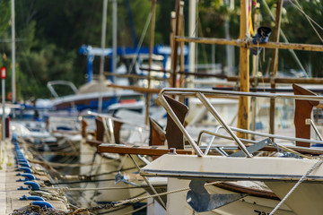 boats docked in a mediterranean harbor town