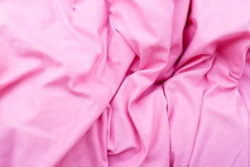 Detailed closeup of pink quilt bedding