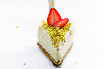 Image of Peace of pistachio mousse cake, cheesecake with fresh strawberry on white background printed on Printed Glass Splashbacks