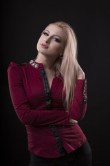 Sexy woman with lush hair and dressed in blouse