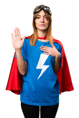 Pretty superhero girl making an oath