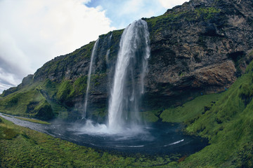 famous Skogarfoss waterfall in southern Iceland. treking in Iceland. Travel and landscape photography concept