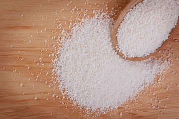 Granulated cassava (tapioca) on wooden background