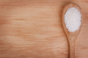 Granulated cassava (tapioca) on wooden background